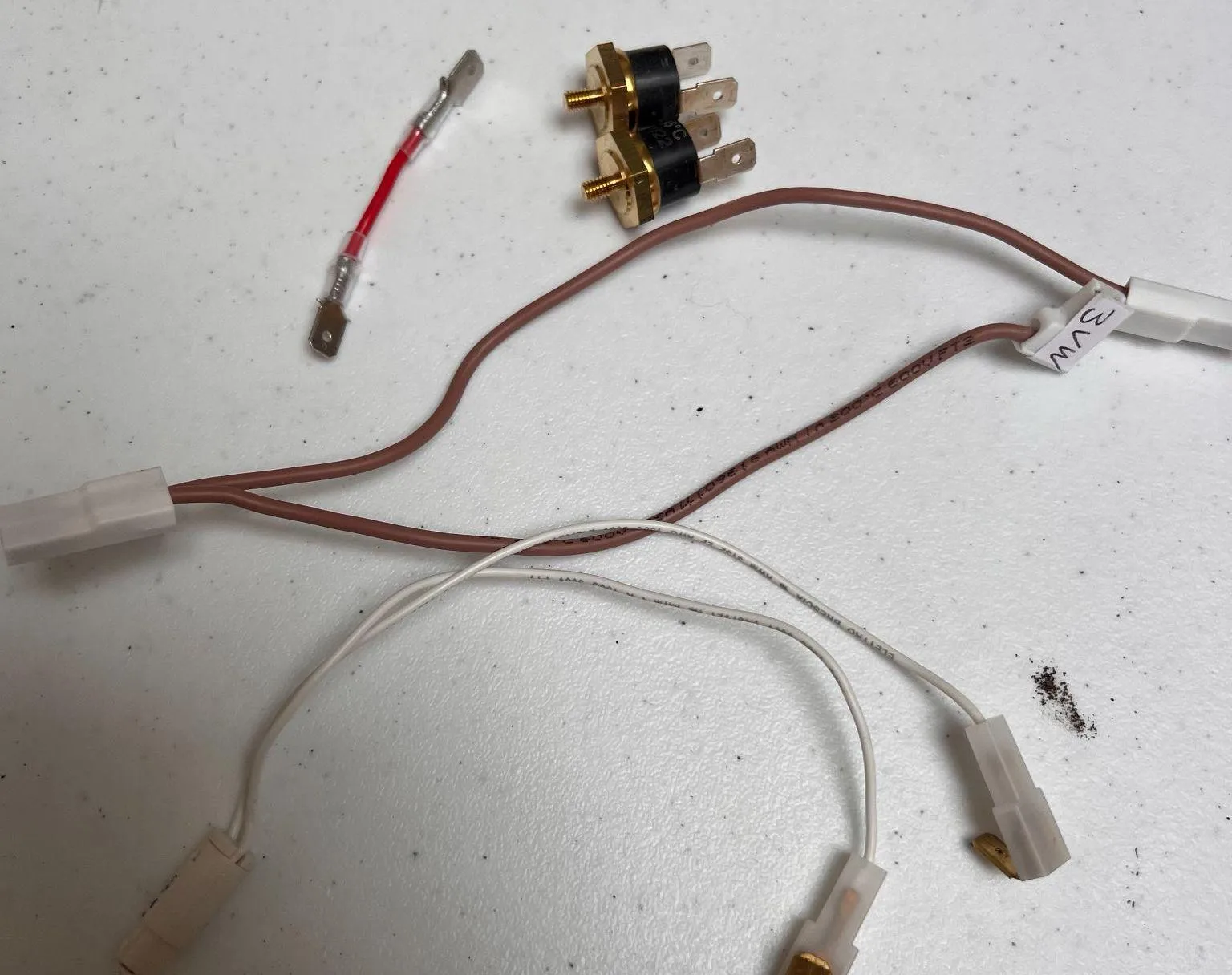Lelit Anna harness after Step 1: ready light disconnected, both thermostats removed, Steam and Coffee buttons disconnected, original 3-way valve cable fully removed